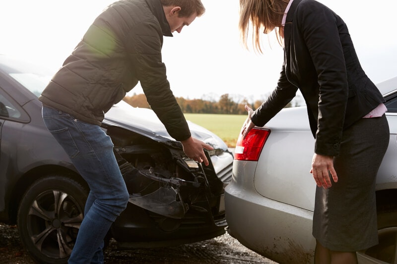 Two Drivers Arguing Over Damage To Cars After Accident